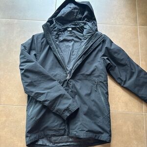 The North Face Black Raincoat with Hood and Weather-Resistant Design